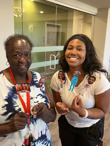 A senior care participant with their puppet self.